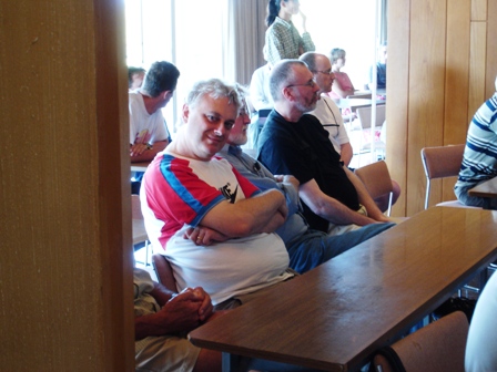 John Nunn at the PCCC meeting at Rhodes in 2007, shortly after winning the World Chess Solving Championship. To his left are Allan Bell, Brian Edwards and Michael McDowell.